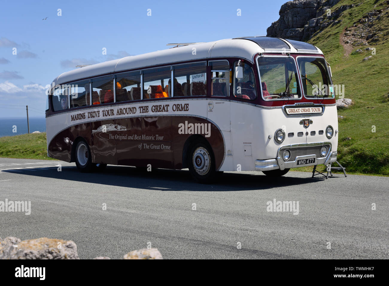 Great Orme and all it's tour bus at the top of the great orme cliff views. Stock Photo