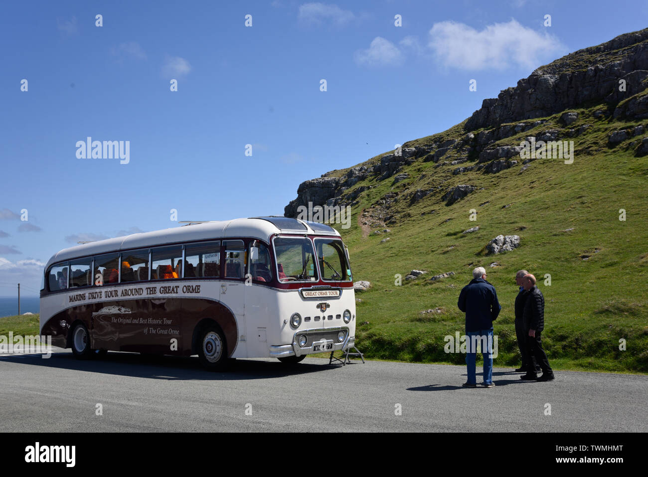 Great Orme and all it's tour bus at the top of the great orme cliff views. Stock Photo