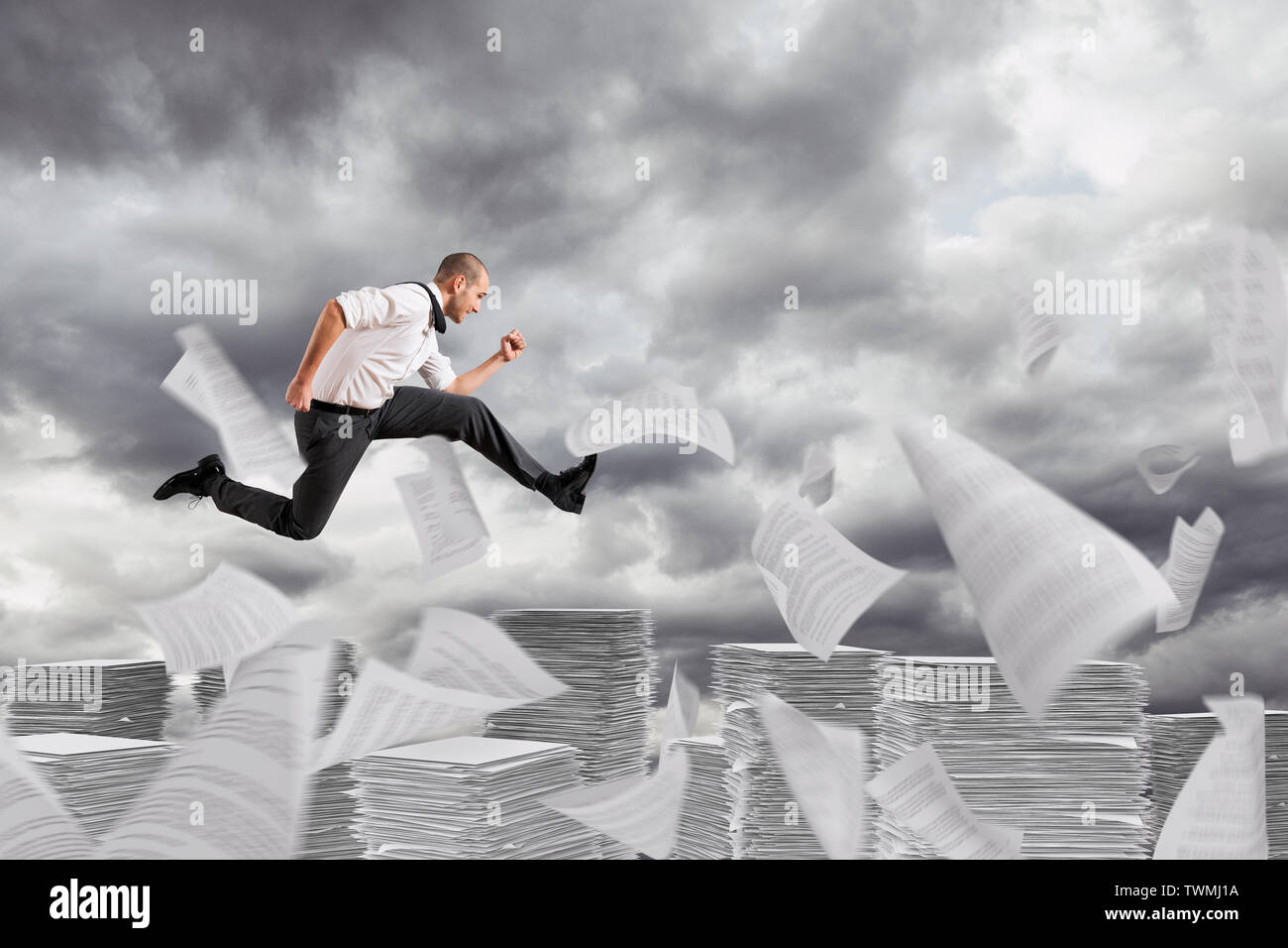 Businessman runs away from the worksheets and bureaucracy Stock Photo ...