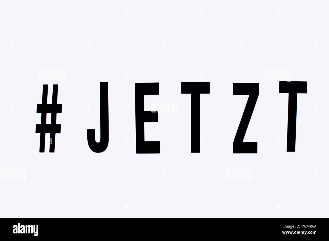 JETZT / NOW Schrift Stock Photo