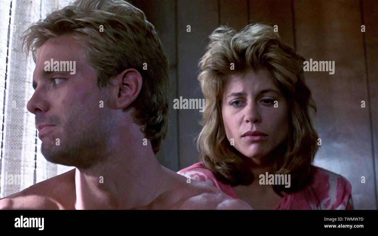 USA. Linda Hamilton and Michael Biehn in a scene from the ©Orion Pictures  movie: The Terminator (1984). Plot: A seemingly indestructible robot is  sent from 2029 to 1984 to assassinate a young, image size:1300x812