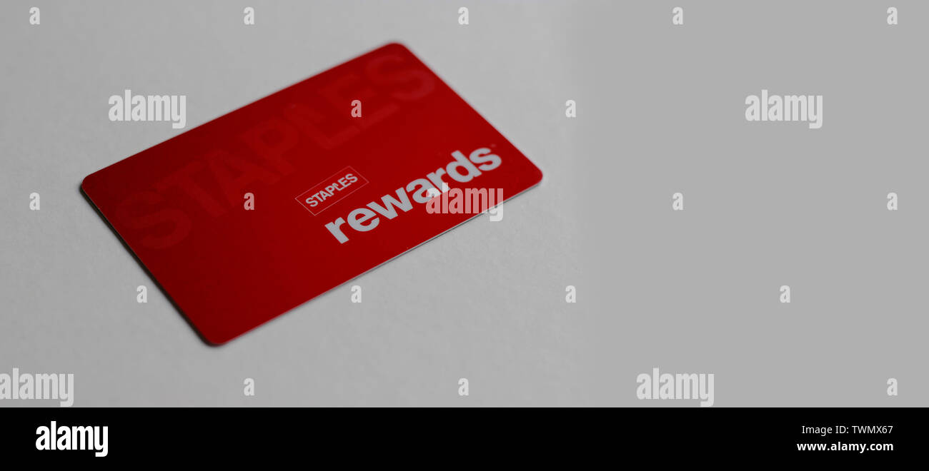 LONDON UK March 2019 Woman's holding a Stapl'es Staples Rewards Card. Retail company. Sale of office supplies and related products, via retail channel Stock Photo