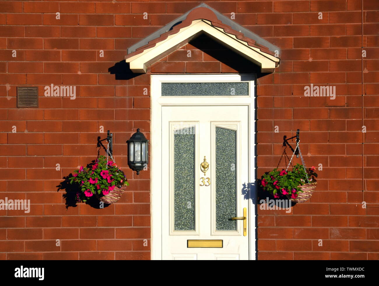 White Door Of A House In Manchester Uk With Hanging