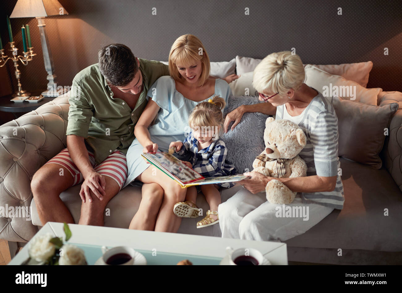 Parents with female child and grandma having fun Stock Photo - Alamy