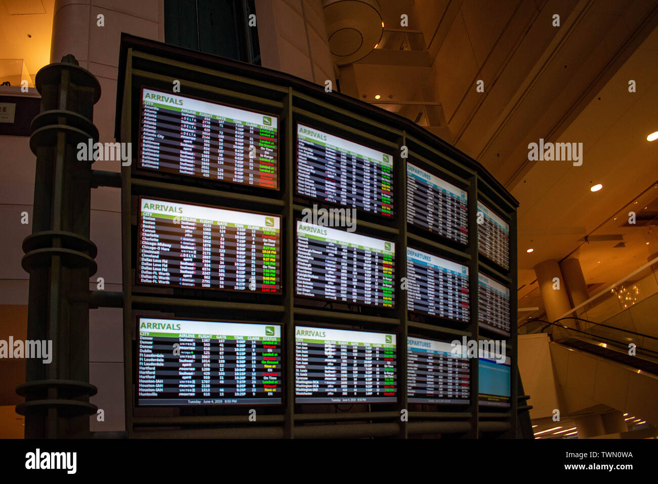 Orlando, Florida. June 06, 2019. Illuminated sign of  Arrivals and Departures airlines time schedules at Orlando International Airport (1) Stock Photo