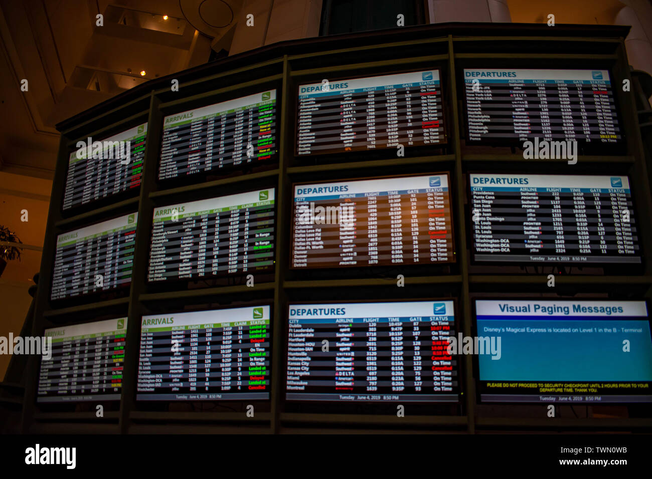 Orlando, Florida. June 06, 2019. Illuminated sign of  Arrivals and Departures airlines time schedules at Orlando International Airport (1) Stock Photo