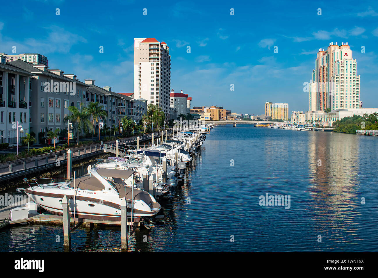 Tampa Bay, Florida. April 28, 2019 . Luxury boats in Harbour Island dockside on lightblue sky background (3) Stock Photo