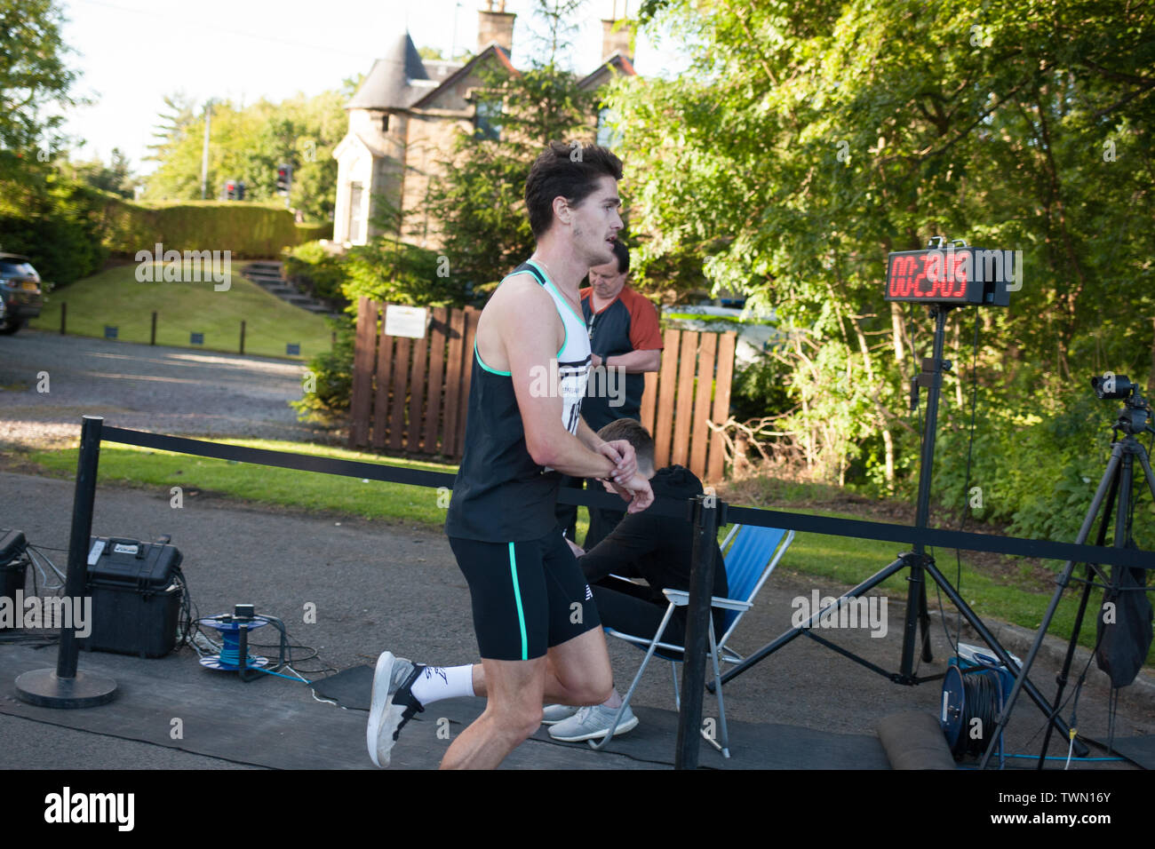 Glasgow, Scotland. 21st June, 2019. The Brian Goodwin Memorial 10km road race, hosted by Bellahouston Harriers running club, and held in Glasgow's scenic Pollok Country Park, was tonight won by Olympian Callum Hawkins in a time of 29minutes 06secs. (Hawkins, pictured, wears Bib 199, Kilbarchan AAC); 2nd male was Jamie Crow (Bib 108, Central AC)) with a Personal Best time of 29min 43sec, and 3rd male was James Donald (30:11, Bib 130, Dundee Hawkhill Harriers).  Credit: jeremy sutton-hibbert/Alamy Live News Stock Photo