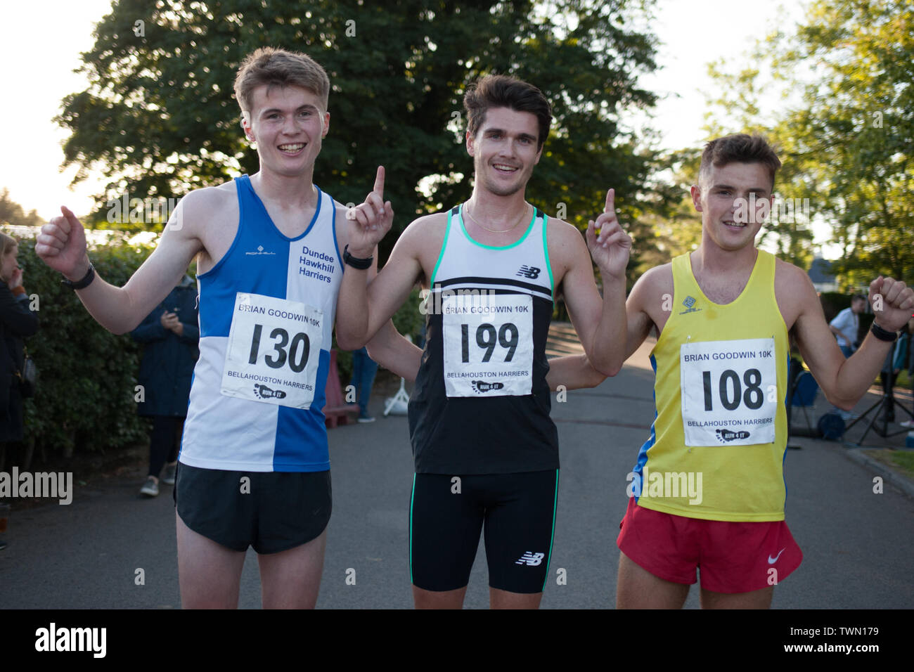 Glasgow, Scotland. 21st June, 2019. The Brian Goodwin Memorial 10km road race, hosted by Bellahouston Harriers running club, and held in Glasgow's scenic Pollok Country Park, was tonight won by Olympian Callum Hawkins in a time of 29minutes 06secs. (Hawkins wears Bib 199, Kilbarchan AAC); 2nd male was Jamie Crow (Bib 108, Central AC)) with a Personal Best time of 29min 43sec, and 3rd male was James Donald (30:11, Bib 130, Dundee Hawkhill Harriers).  Credit: jeremy sutton-hibbert/Alamy Live News Stock Photo
