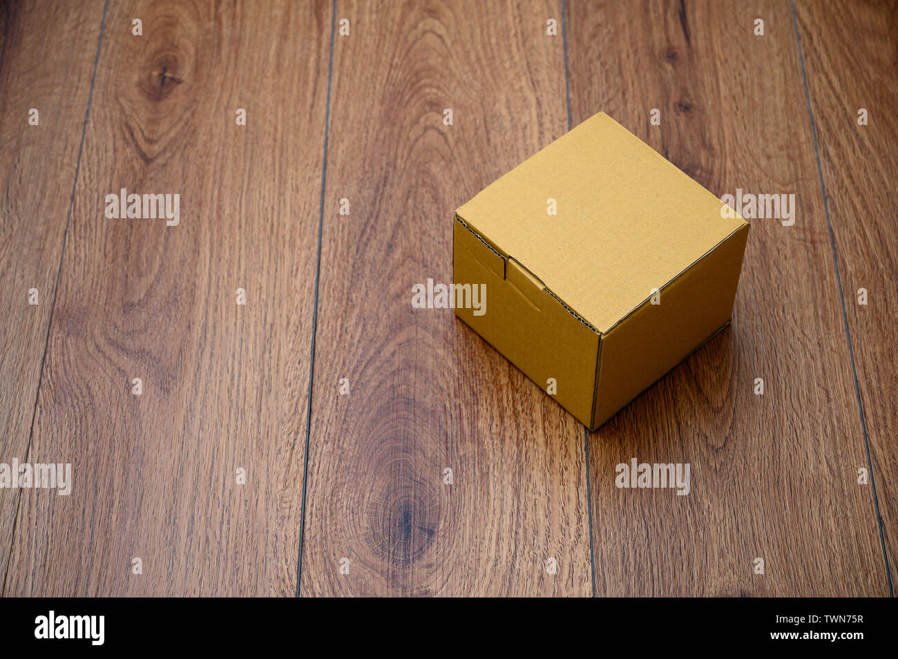 box empty open cardboard box on wooden surface with empty space top Flat lay Stock Photo