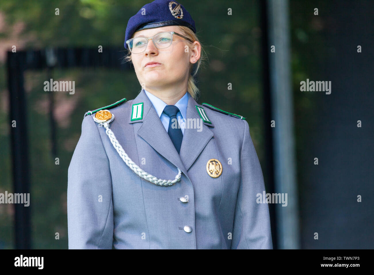 AUGUSTDORF / GERMANY - JUNE 15, 2019: German female soldier in full dress uniform walks on a stage at Day of the Bundeswehr 2019. Stock Photo