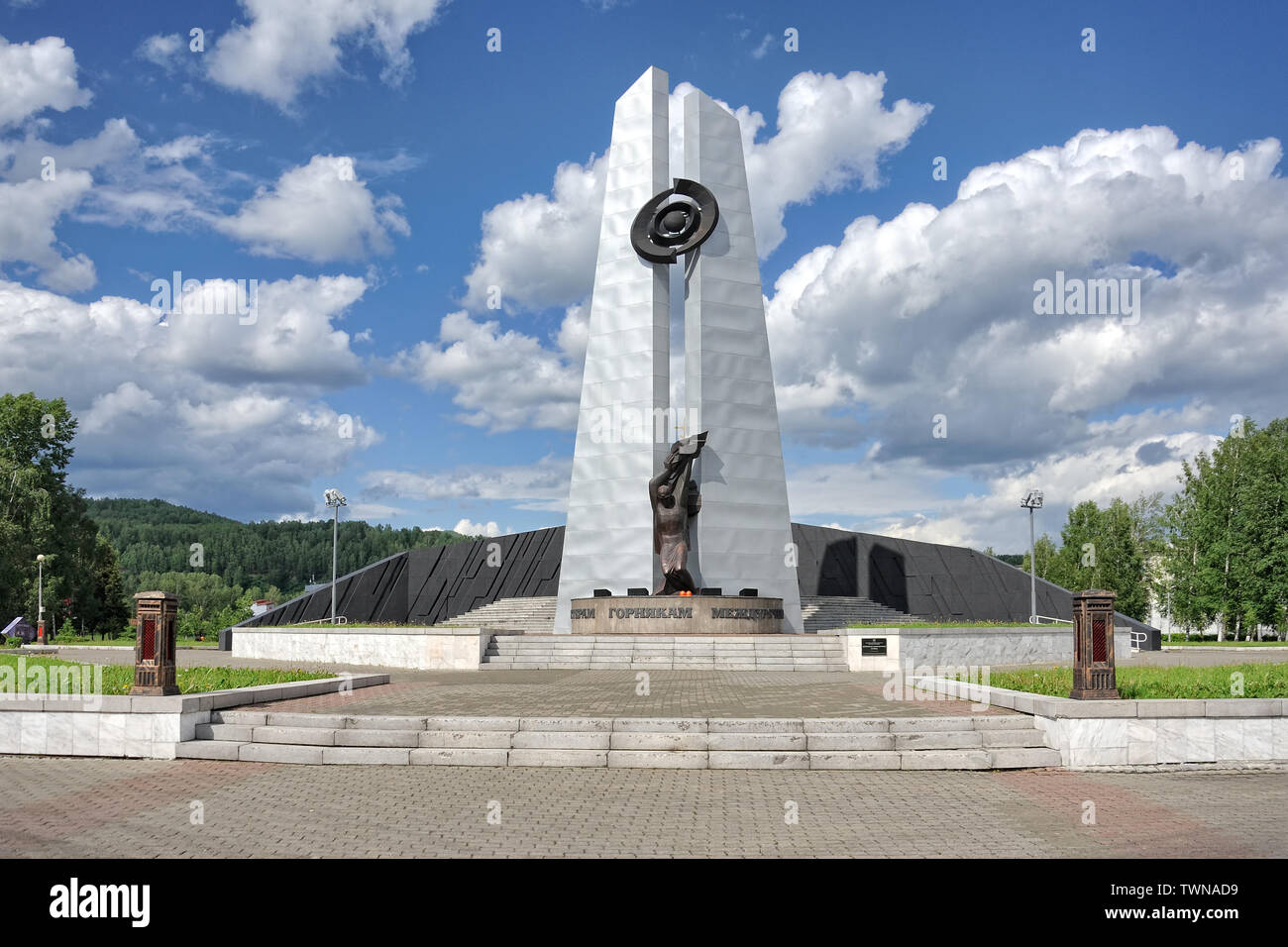 = Monument to the Fallen Miners of Mezhdurechensk =  Front view of the impressive “Miner's Glory Memorial” in Mezhdurechensk founded in the local city Stock Photo