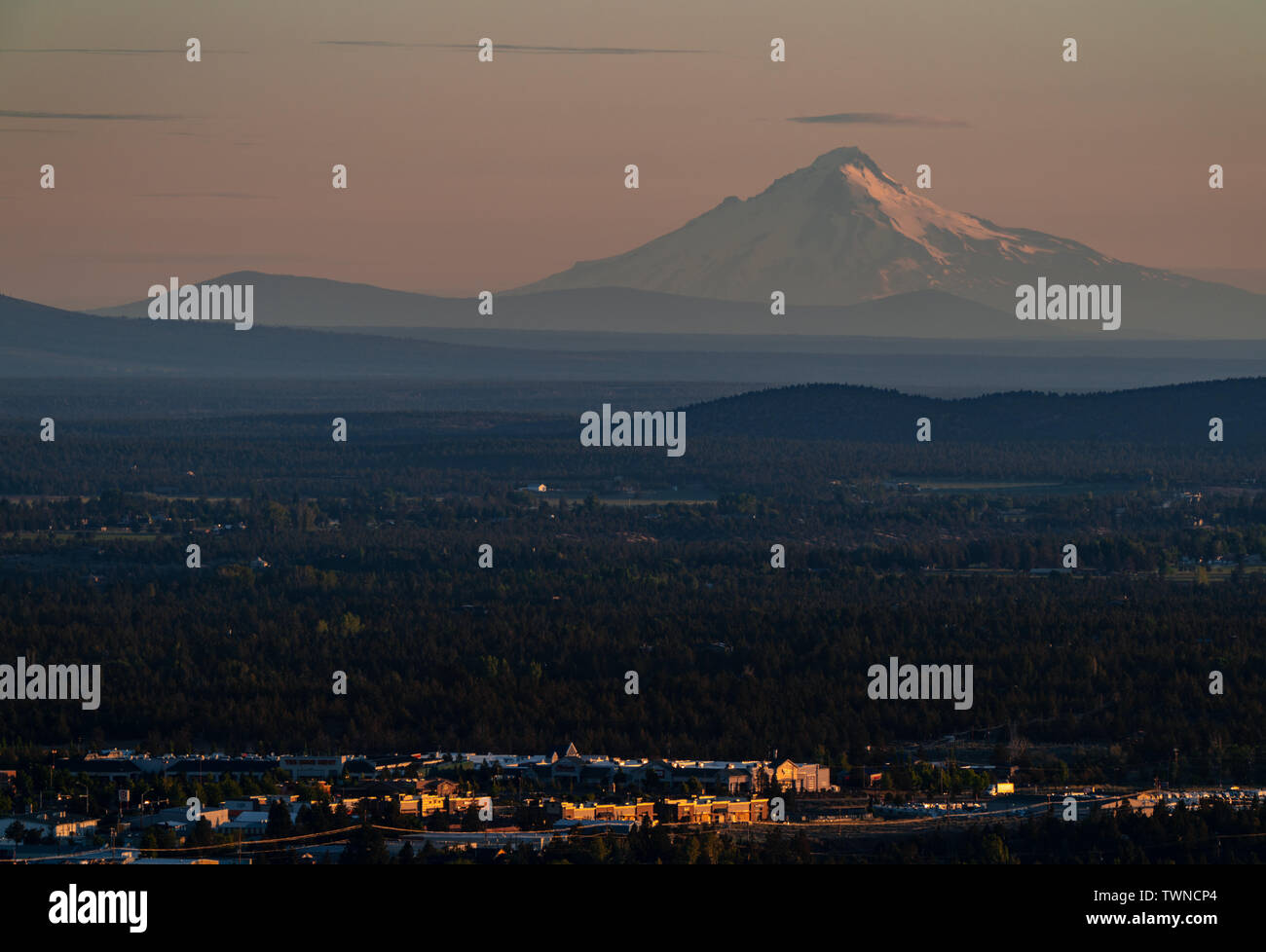 hazy sunrise view onto snow capped volcano in Bend Oregon, USA Stock Photo
