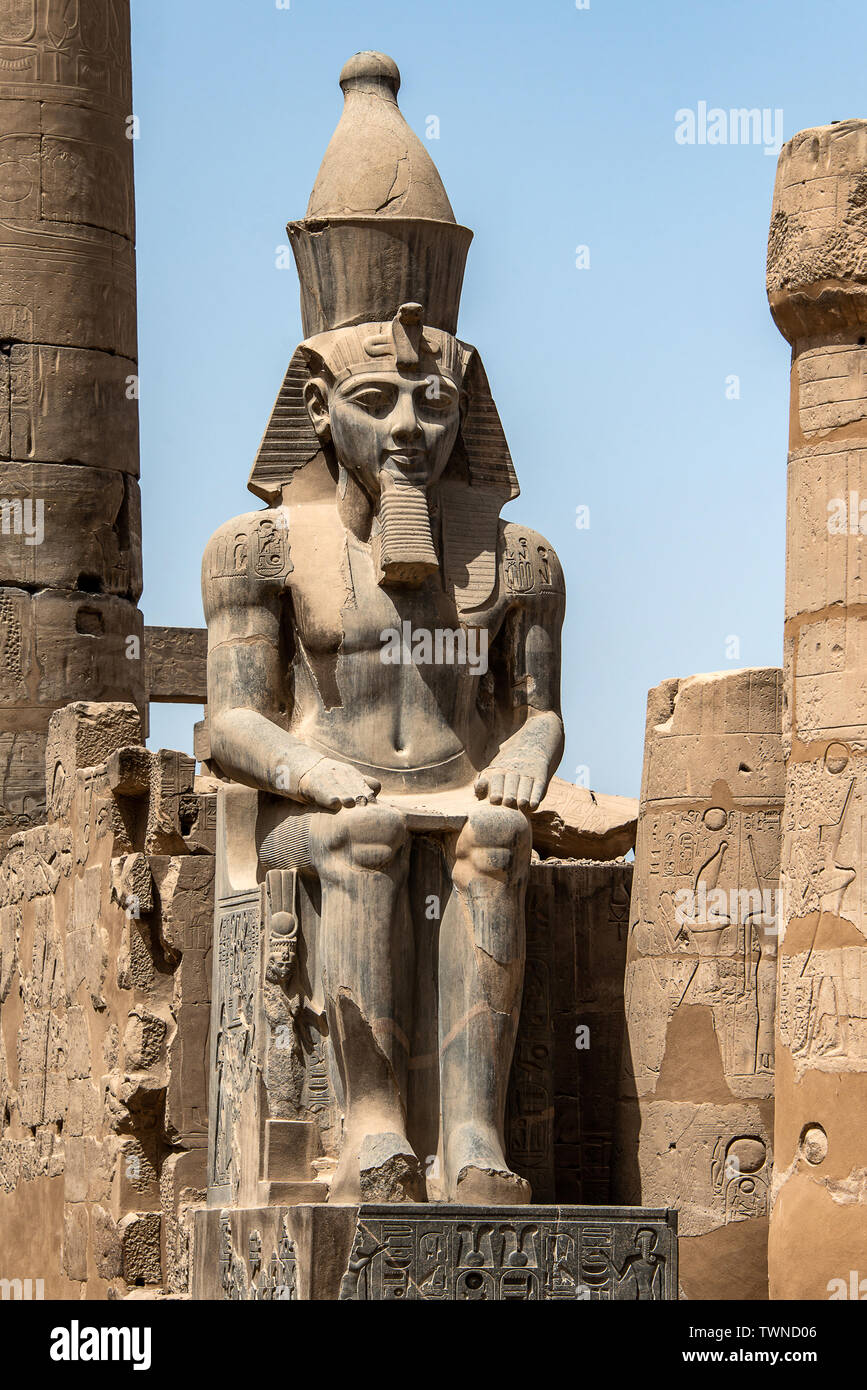 Egypt Luxor Temple. granite Statue of Ramesses II seated in front of ...