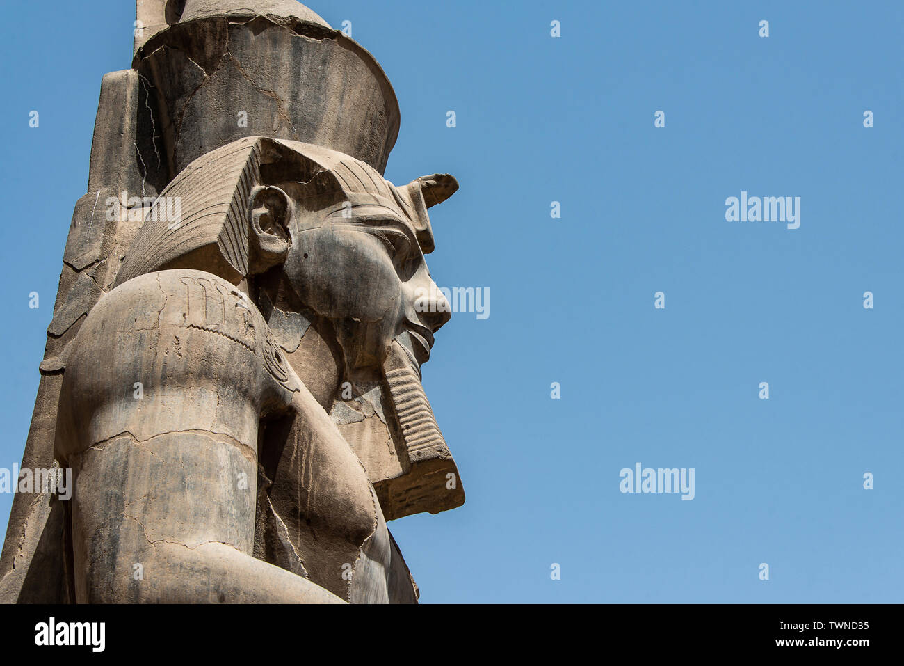 Egypt Luxor Temple. granite Statue of Ramesses II seated in front of