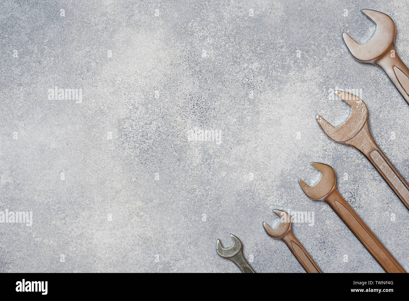 Wrenches, tools on gray concrete background with copy space Stock Photo