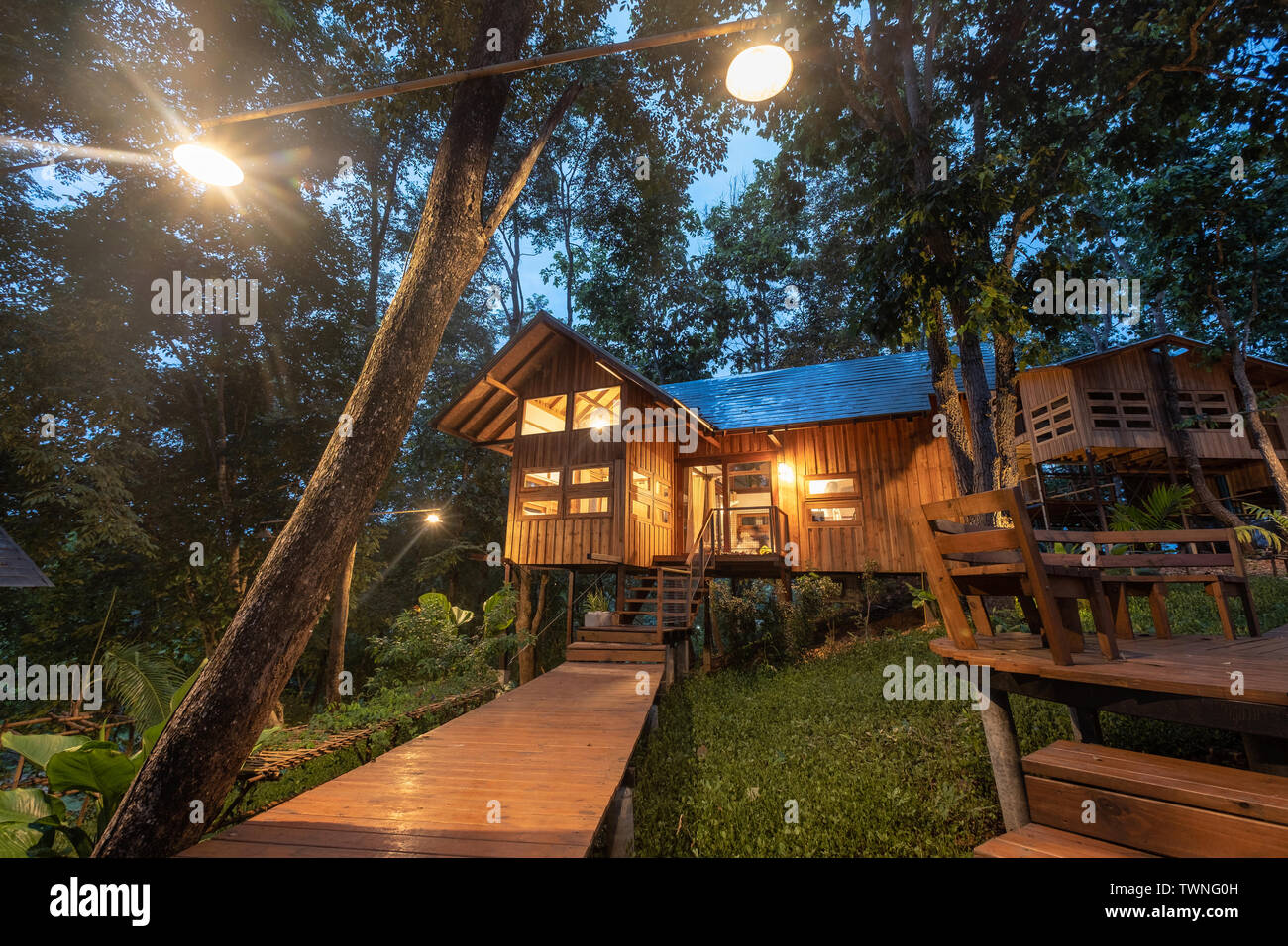 Architecture wooden house with illumination in rainforest Stock Photo ...