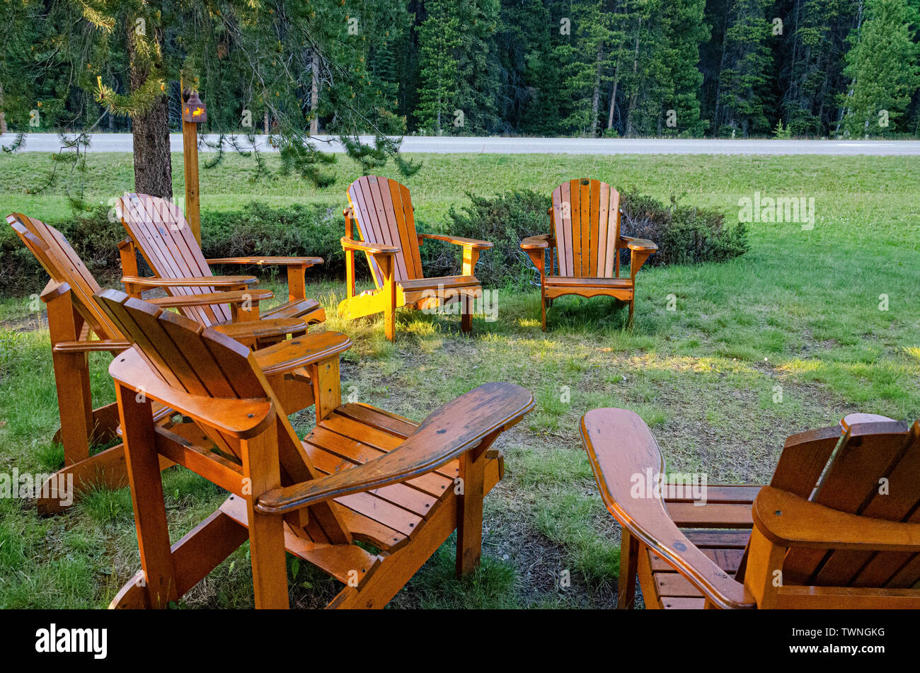 6 Adirondack Chairs in a yard in canada Stock Photo - Alamy