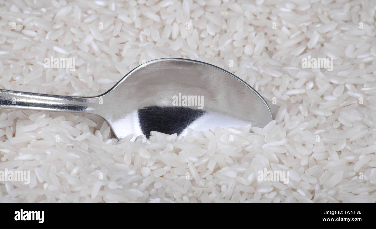 rice food background and teaspoon Stock Photo Alamy