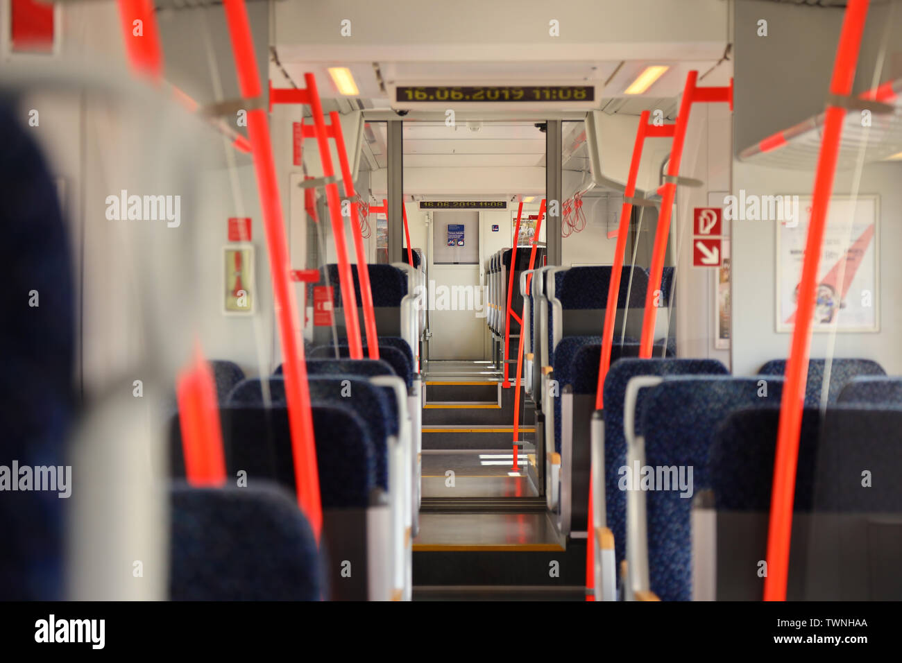 Inside of a regional Austrian train that commutes from Eisenstadt to Vienna. The commuted train is operated by OEBB (Austrian Railways) Stock Photo