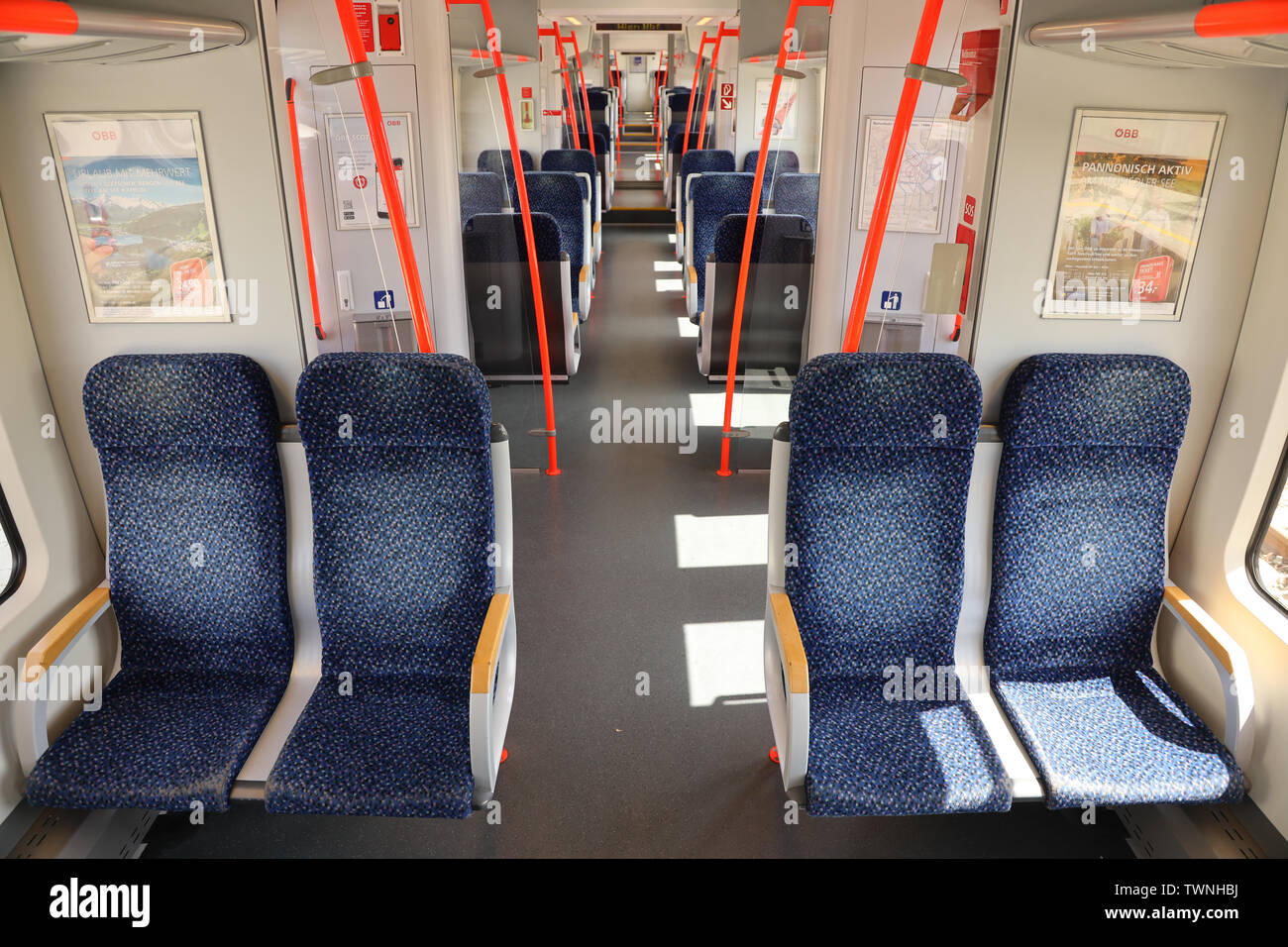 Inside of a regional Austrian train that commutes from Eisenstadt to Vienna. The commuted train is operated by OEBB (Austrian Railways) Stock Photo