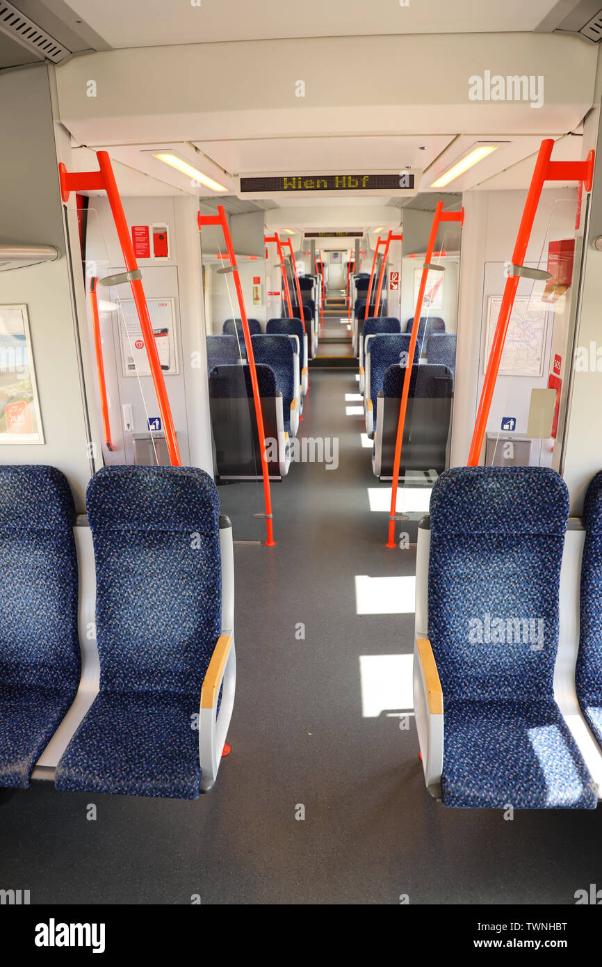 Inside of a regional Austrian train that commutes from Eisenstadt to Vienna. The commuted train is operated by OEBB (Austrian Railways) Stock Photo