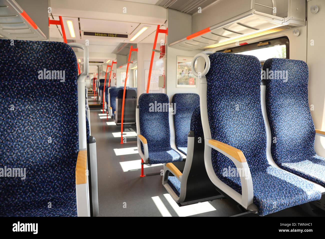 Inside of a regional Austrian train that commutes from Eisenstadt to Vienna. The commuted train is operated by OEBB (Austrian Railways) Stock Photo