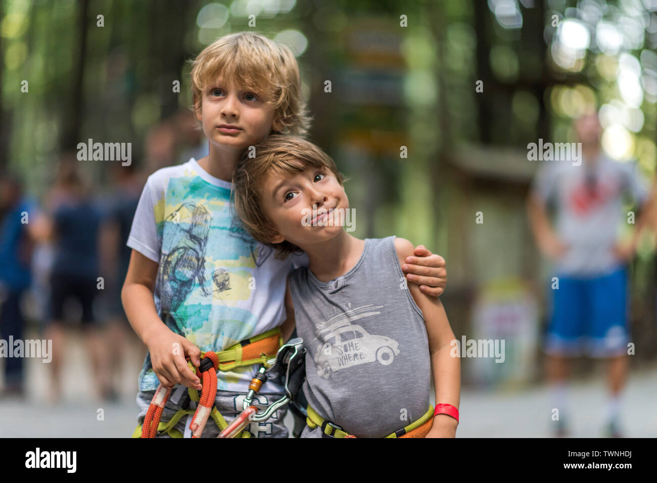 The two friends spend quality time together at a playground, having fun, being the subjects of a photo session as models for all children, to show how Stock Photo