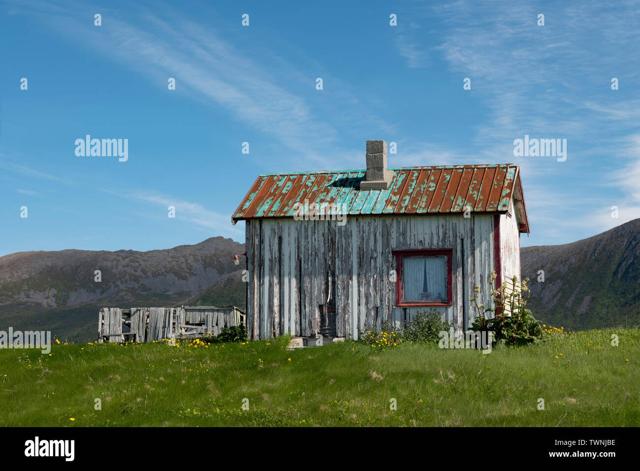 An old cabin close to the road at Stave, Andoya, Vesteralen, Norway Stock Photo