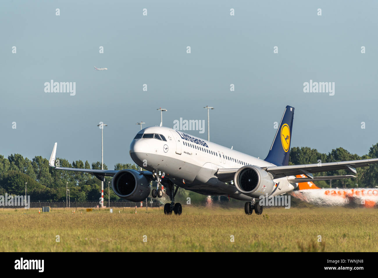 A picture of a Lufthansa aircraft taking off from Schiphol airport Stock Photo