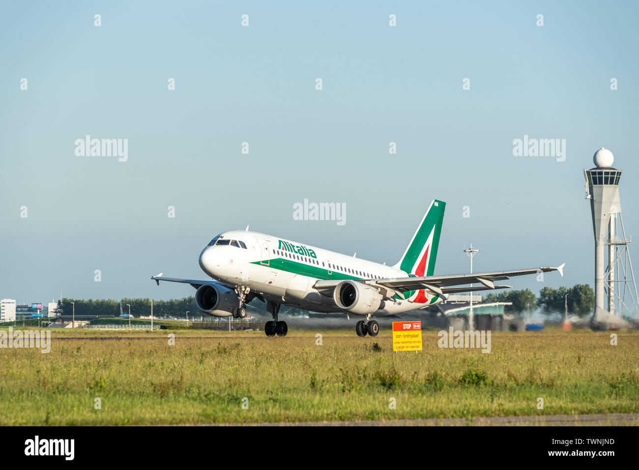A picture of an Alitalia aircraft taking off from Schiphol airport Stock Photo