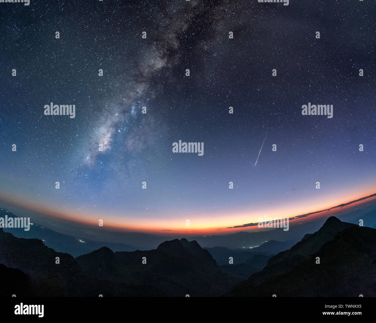 Milky way galaxy with shooting star at twilight sunset on mountain ...