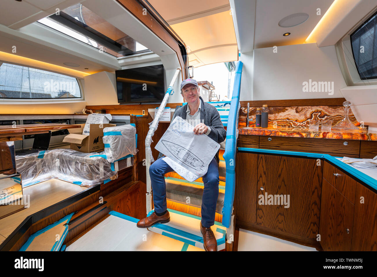 Software entrepreneur and owner of Oyster Yachts, Richard Hadida, pictured on board his own Oyster 885, Lush, in Southampton where it is undergoing a Stock Photo