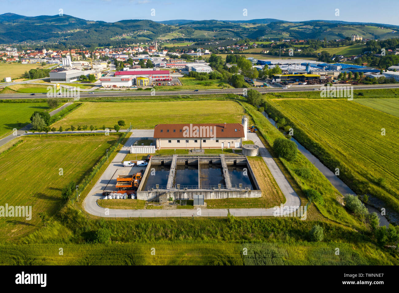 Slovenska Bistrica, Slovenia - June 9 2019: Aerial view of wastewater and sewage treatment plant in the outskirts of Slovenska Bistrica. Stock Photo