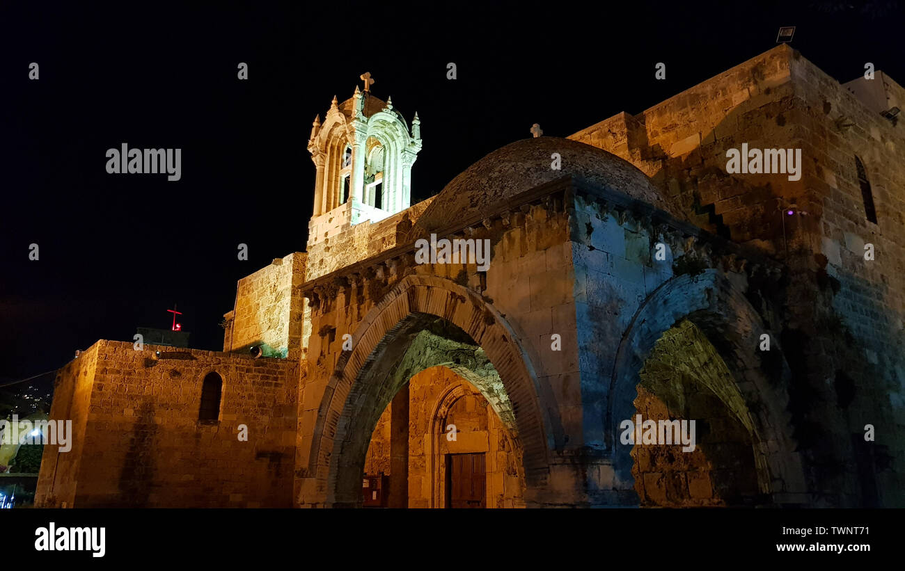 The Crusades-era Church of St. John-Mark in Byblos by night. Byblos, Lebanon - June, 2019 Stock Photo