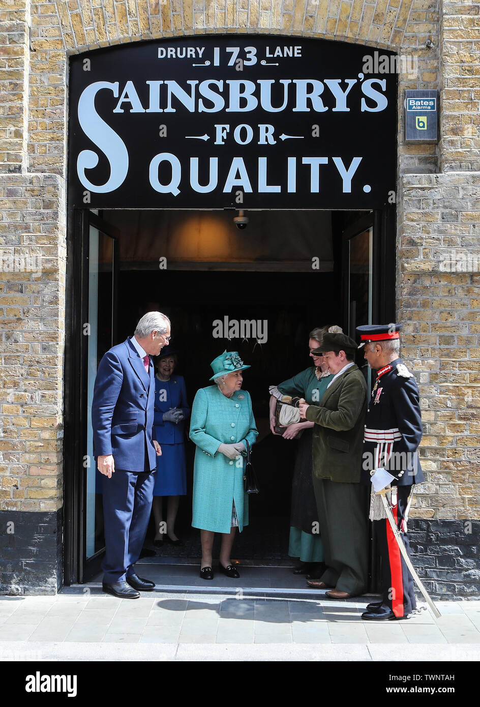 Queen Elizabeth visits a popup store during the 150th anniversary of