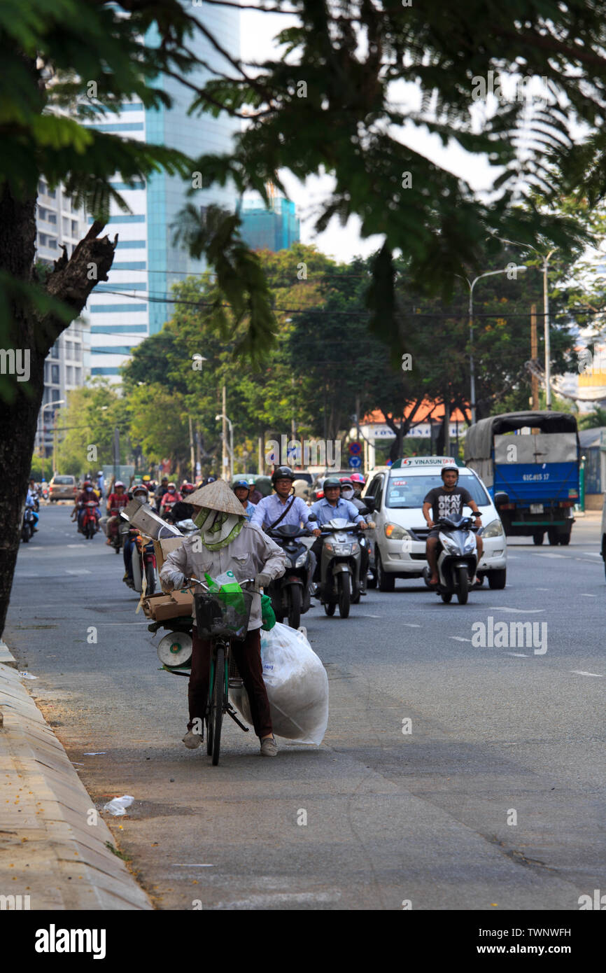 Saigon, Vietnam - April 21, 2014: Chaotic road traffic in Saigon, Vietnam. In the biggest city in Southern Vietnam are more than 4 mil. motorbikes, th Stock Photo