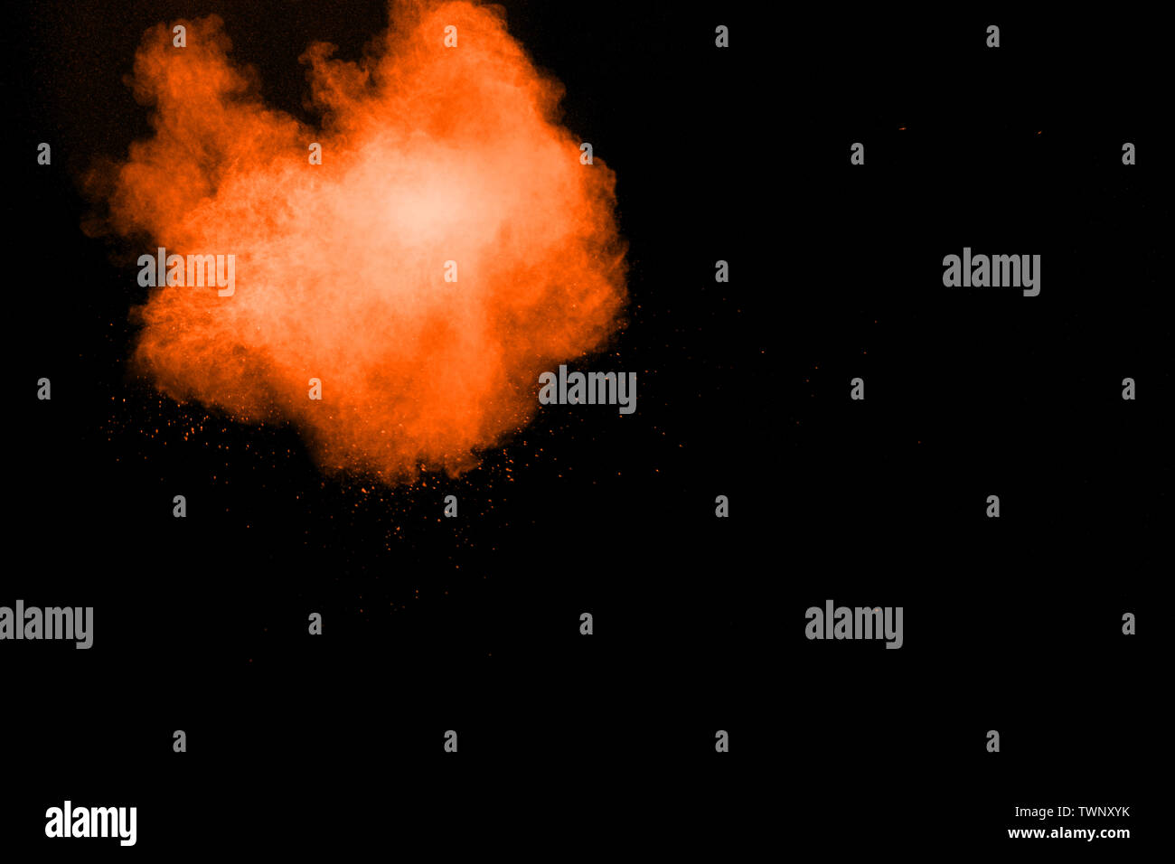Abstract multicolored dust explosion on black background. Abstract color powder splash on dark background. Stock Photo