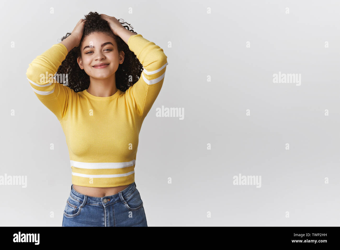 Attractive Carefree Relaxed Modern Young Mixed Race Curly Haired
