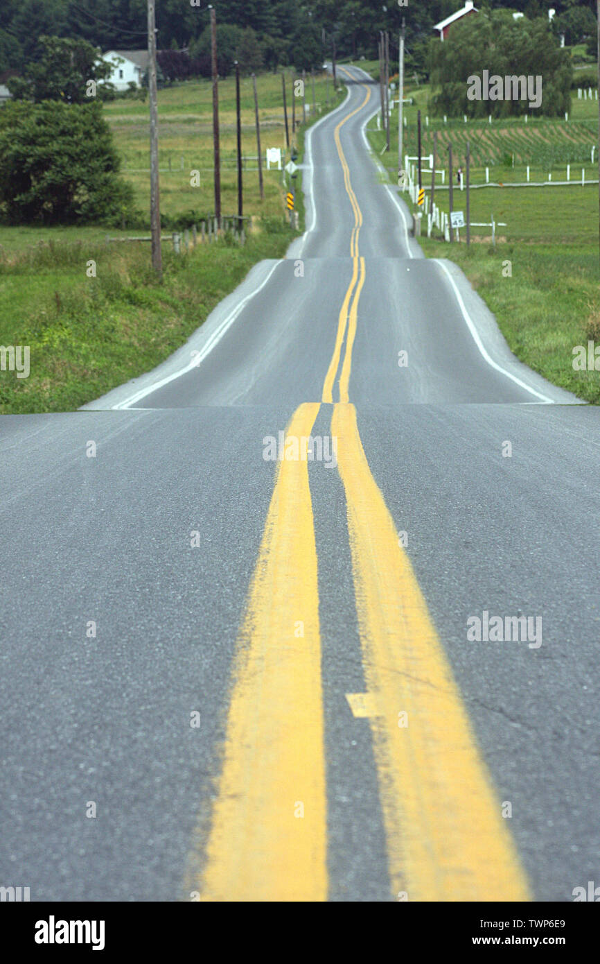 Road through the picturesque Lancaster County in Pennsylvania, USA Stock Photo