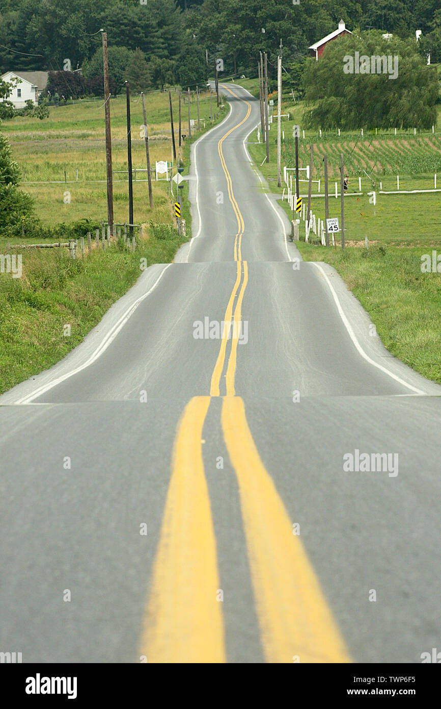 Road through the picturesque Lancaster County in Pennsylvania, USA Stock Photo