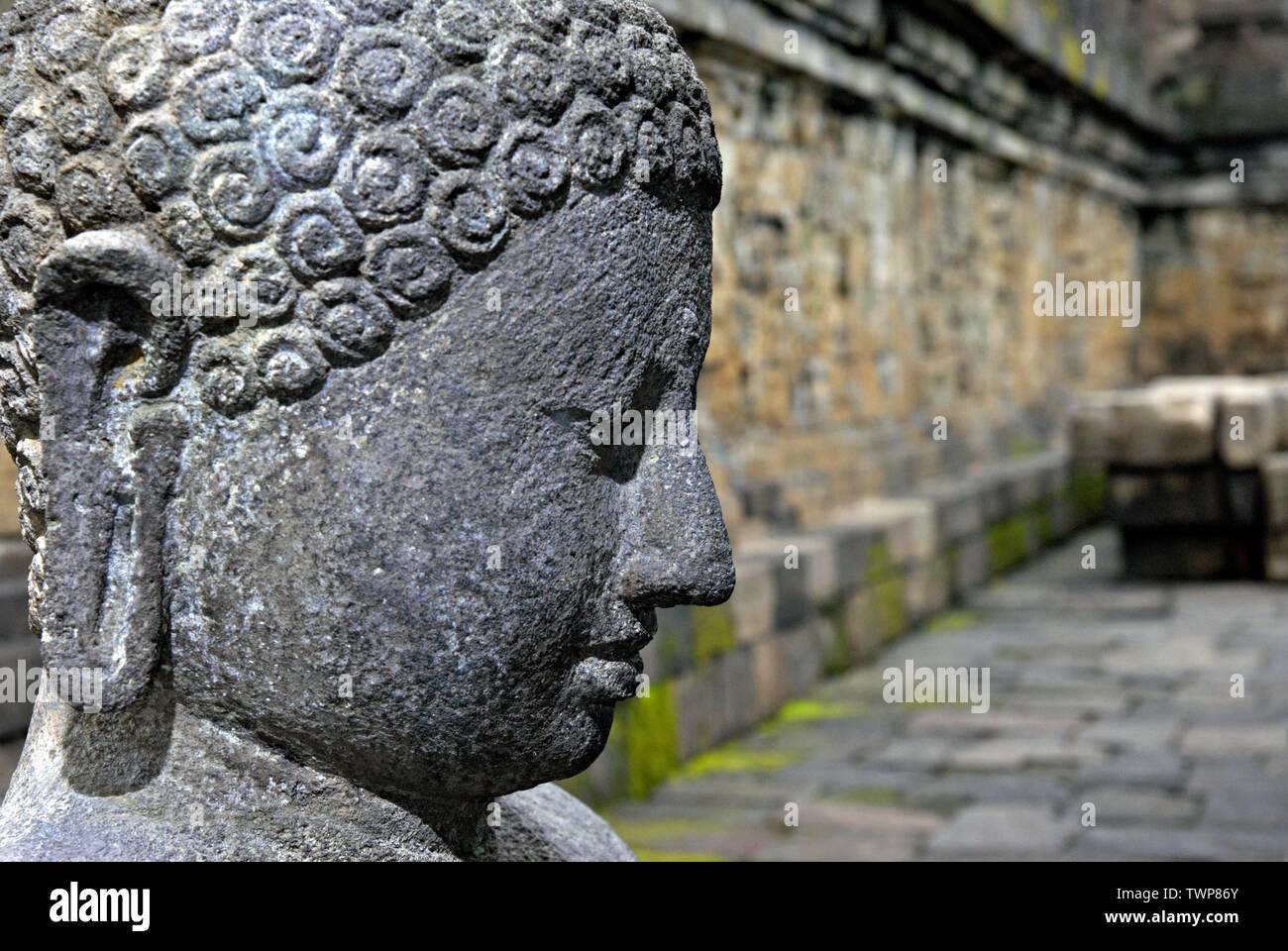The Buddha statue in Borobudur. Borobudur is a 9th-century Mahayana Buddhist temple. It is the world's largest Buddhist temple. Stock Photo