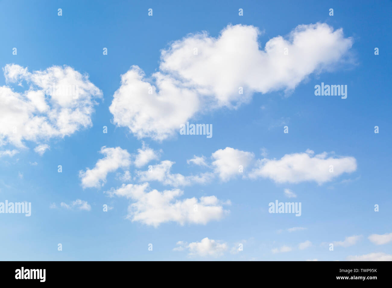 Blue sky and fluffy clouds Stock Photo