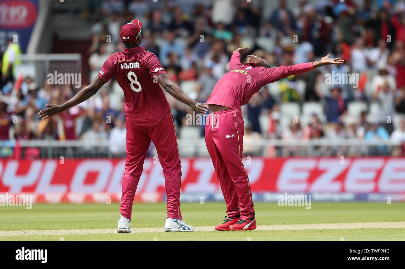 West Indies Sheldon Cottrell celebrates taking the wicket of New