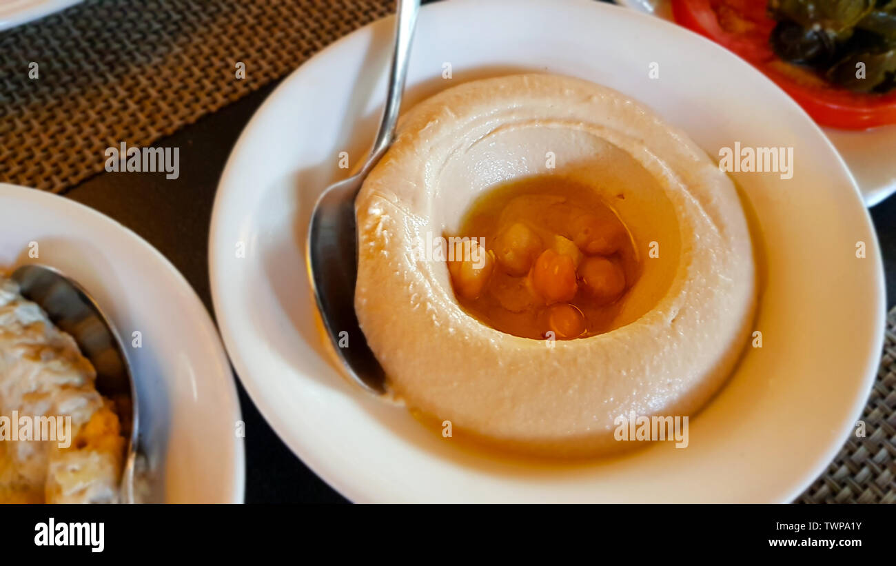 Hummus, dip or spread made of blended chickpeas, sesame tahini, lemon