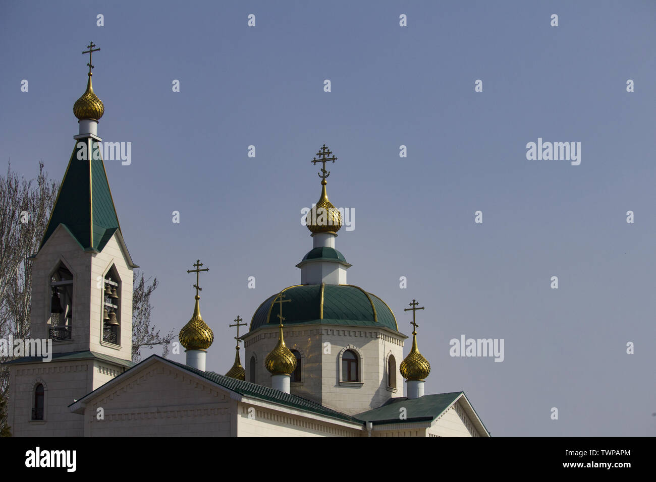 Orthodox church dome with a cross on a background of the cloudy sky ...