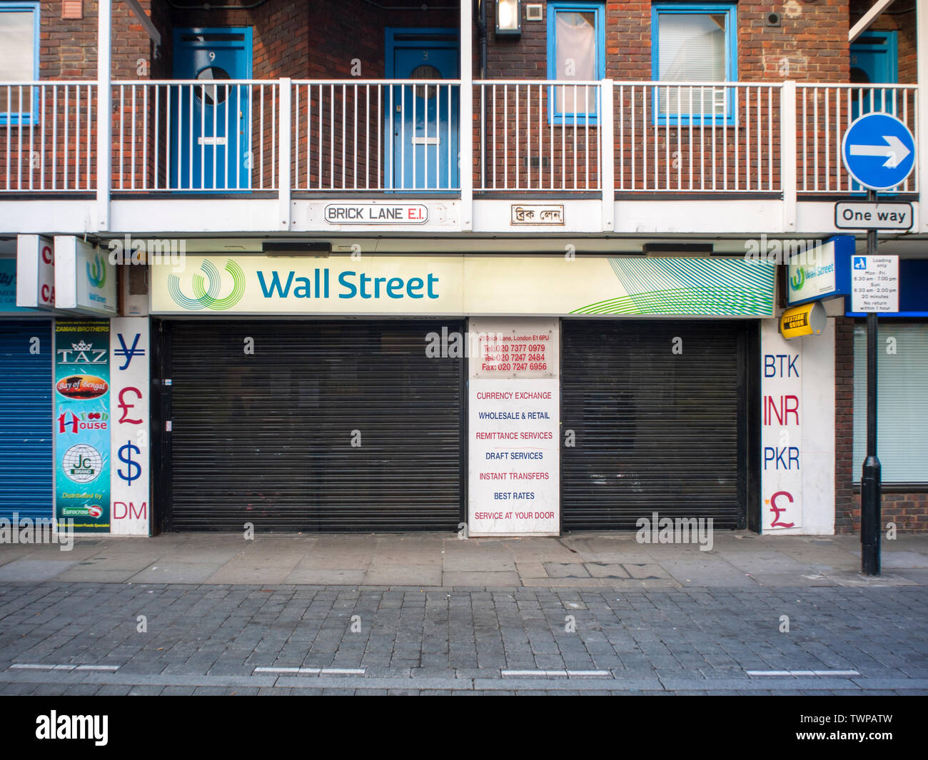 Brick Lane, London, 2009 - at the height of the global banking crisis this shop on this well known east end shop front seem ironic. Stock Photo