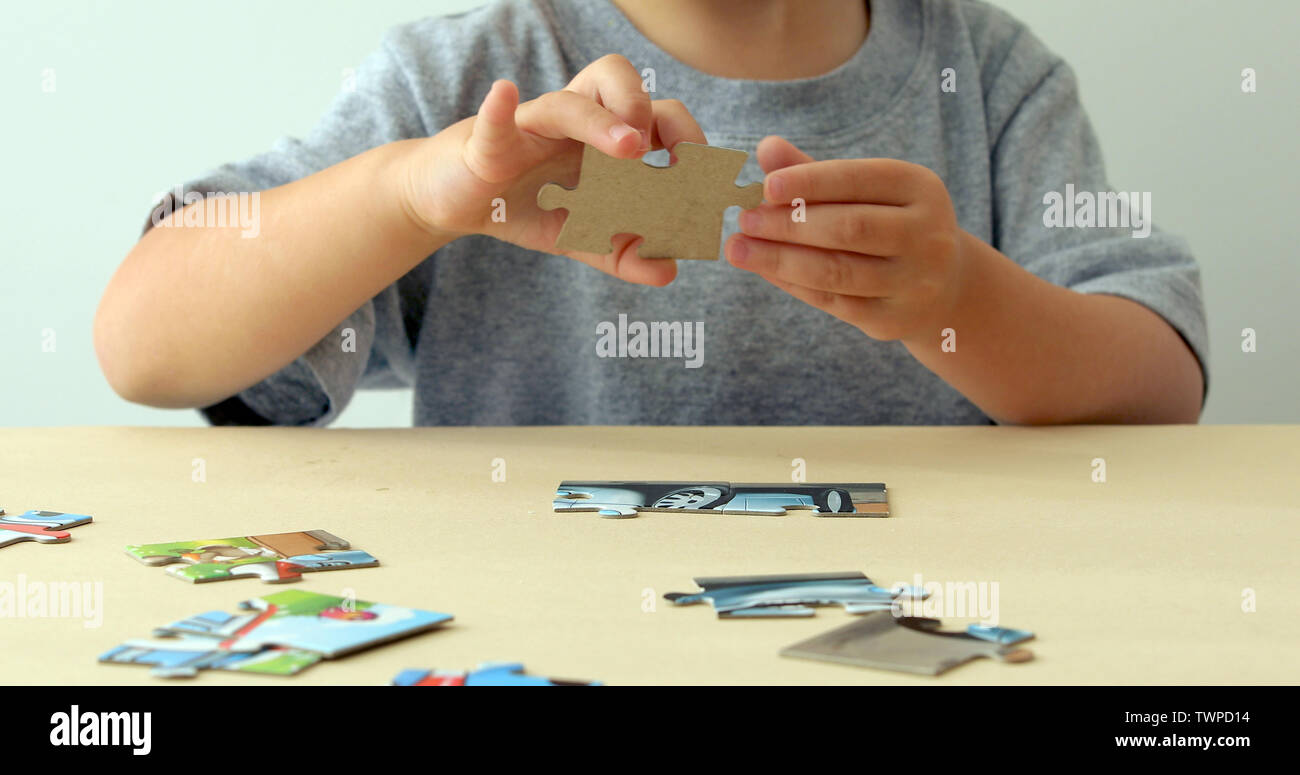 Baby hand fold puzzle Stock Photo
