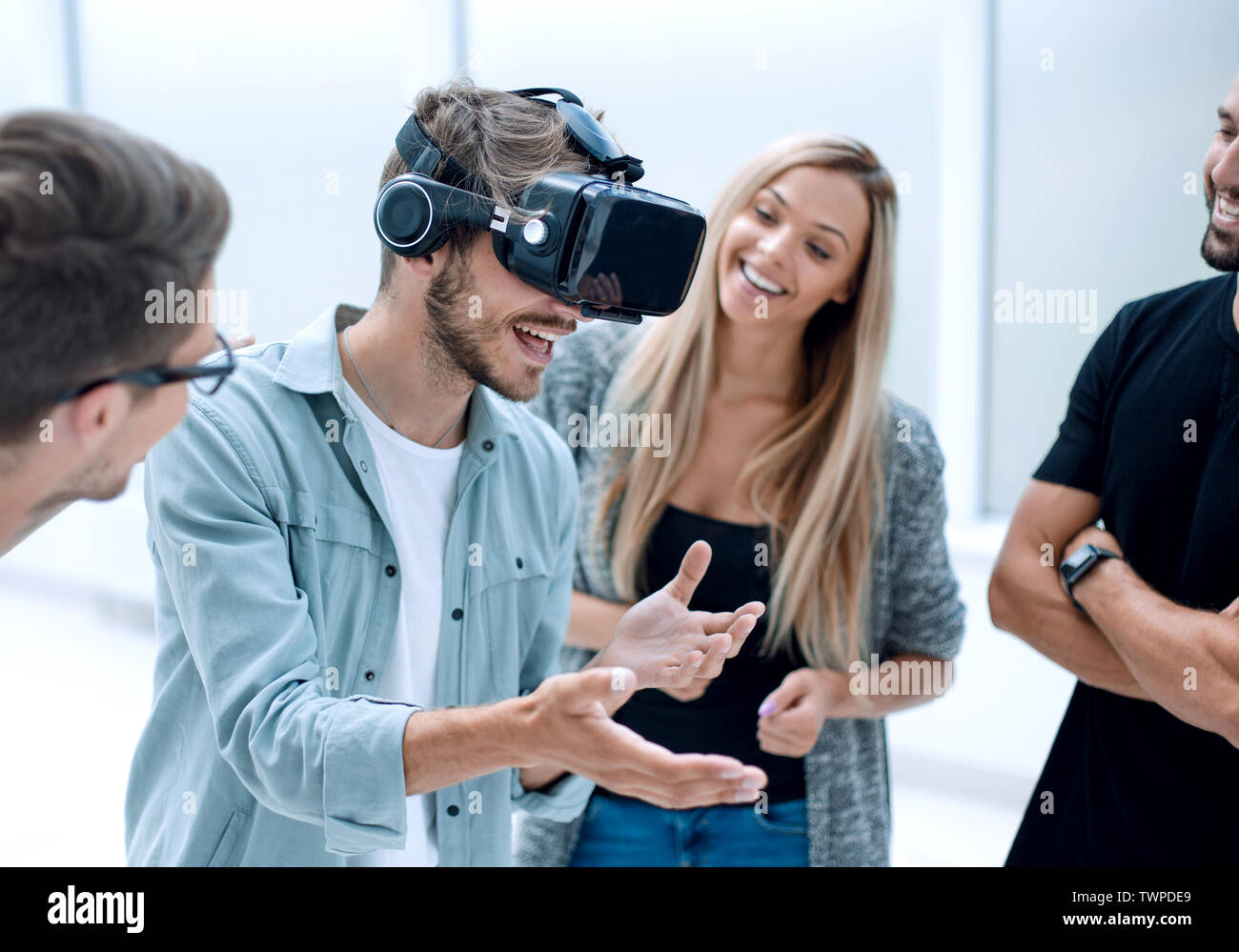 Positive colleagues testing virtual reality glasses Stock Photo