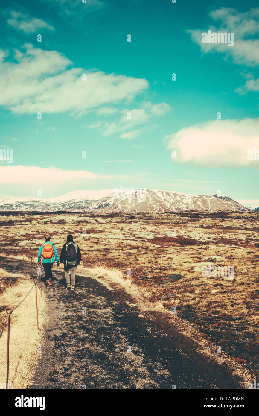 Two Young Women Hiking On A Trail In Iceland With Copy Space Stock Photo